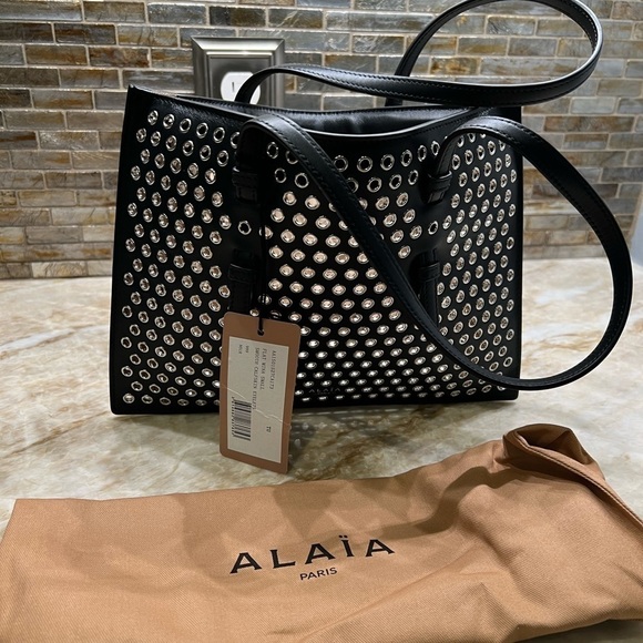 ALAÏA Mina Small perforated leather tote bag - Picture 13 of 14